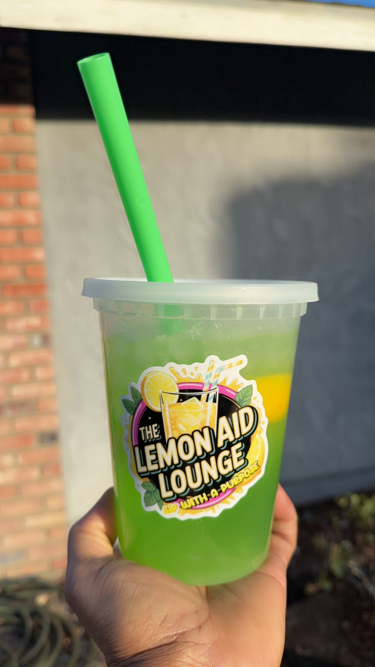 Bright green apple lemonade from The Lemon Aid Lounge LLC