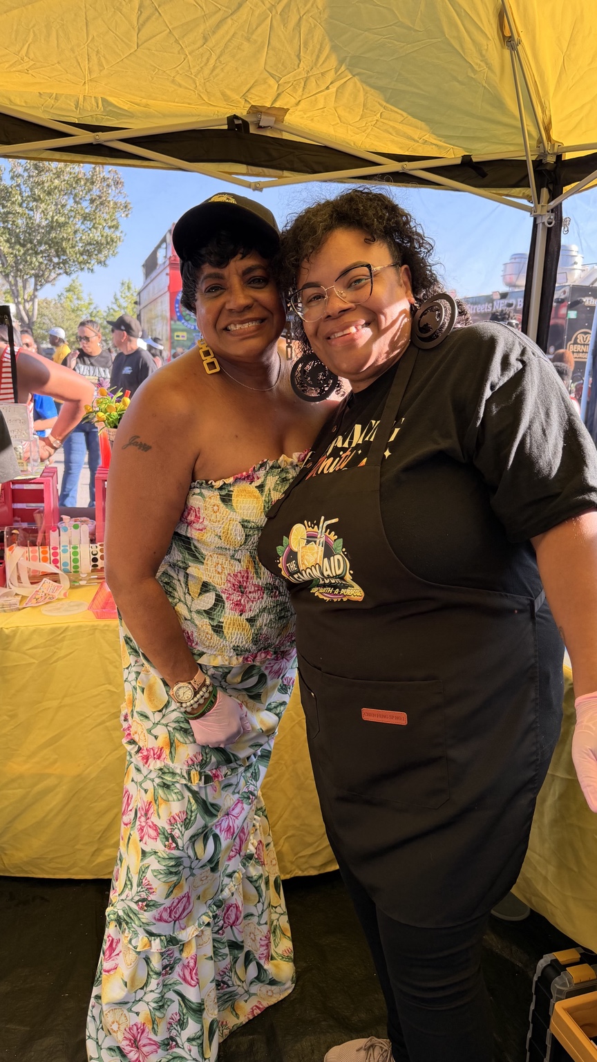The Lemon Aid Diva with a community partner at an outdoor event